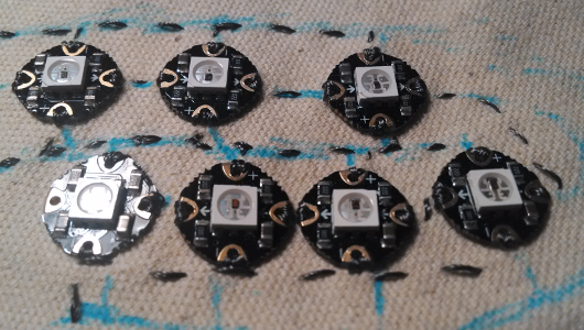 Seven pixels fully stitched into the design. The bottom pixels, particularly the two in the middle, are quite close together