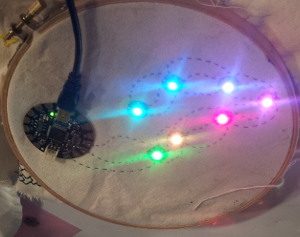 Seven LEDs are lit in a rainbow pattern at full brightness